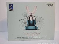 Photo of boxed Wekome WT-C01 electric U-shaped toothbrush which shows front packaging with brand, model and image of the device on charging base.