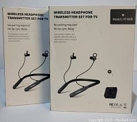 Two boxed wireless headphone transmitter sets for TV Model HT4806 shown front view. Boxes are white with product image and text.