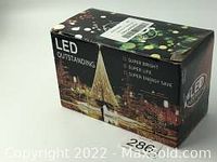 Box of 40 LED string lights with warm white maple leaf shaped bulbs, new in original packaging