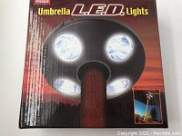 Box packaging of Focus brand umbrella LED lights showing product name and image of light fixture mounted on umbrella pole.