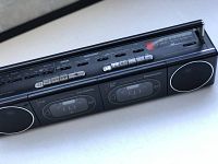 Front angle view of Panasonic dual cassette player showing two cassette compartments and top control buttons