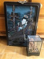 Framed painting featuring an Asian woman dressed in traditional clothing sitting on an ornately carved chair with architectural details behind her.