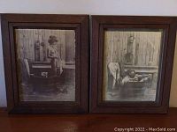 Two framed black and white vintage style bath time prints together showing children in wooden tubs with rustic backgrounds.
