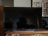 Front view of a 40-inch Haier LED TV powered on.