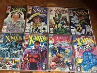 Lot of 8 Classic X-Men comic books in plastic bags showing front covers with various characters and titles.
