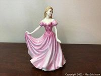 Front view of Royal Doulton Sweetheart figurine showing pink dress and pose