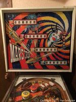 Backglass showing Mars-Trek logo, score windows and space-themed artwork