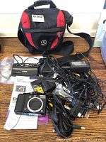 Overview of both cameras, carrying case, chargers, cables and accessories