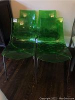 Front view of four chairs showing arrangement and color