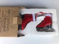 Red ice skate ornament in original box with styrofoam insert