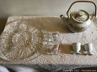 Overview of items showing serving tray, teapot, egg cups and shot glasses
