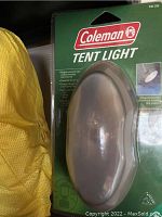 Photo of Coleman Tent Light in original packaging, highlighting product and its features