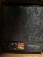 Top-down view showing control panel with temperature and timer dials