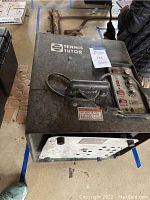 Top view showing the Tennis Tutor logo, carrying handle, and overall condition