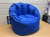 Front view of blue Little Kids Big Joe bean bag chair showing its padded, cushioned design and 'Big Joe' label.