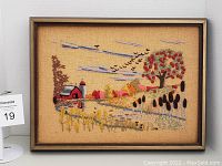 Front view of framed farm crewel needlework showing detailed farm scene with barn, silo, trees, pond, and birds in sky.