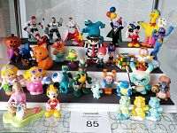 Wide shot showing all toys arranged on a display shelf, displaying variety in theme and colors