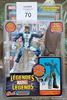 Front view of Marvel Legends Blue Angel figure in original packaging, showing figure and promotional text including bonus comic.