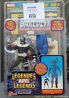 Front view of Marvel Legends Bullseye action figure in sealed original packaging with labeled comic bonus and character details.