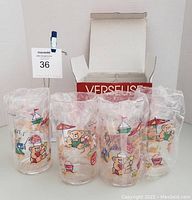Four vintage acrylic tumblers with cartoon bear and beach illustrations, individually wrapped in plastic, shown front view.
