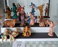 Front view showing the full 14-piece set on display including figurines and animals.