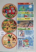 All 7 puzzles laid out flat: 3 round simplex wooden puzzles with colorful animal scenes and 4 rectangular tray frame cardboard puzzles by Golden.