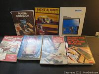 Photo of all seven books arranged side by side for overview.