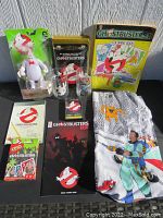 Photo showing entire lot including glasses, coloring book, VHS case, UNO game, and fabric valance