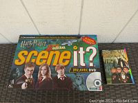 Front of Harry Potter Scene It 2nd Edition French board game box with main characters shown and DVD icon.