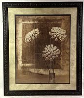 Full photograph of the large floral art print in the ornate French frame showing sepia tone floral image with cream matting and dark ornate frame.