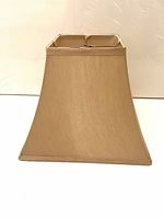 Front view of tan gold silk lampshade showing rectangular shape and fabric texture