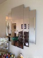 Front view of 35x35 Art Deco style wall mirror with five stepped vertical panels.