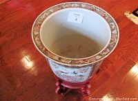 Top view inside the large porcelain fish bowl planter showing smooth white interior and flared decorative rim