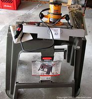 New Rubbermaid Roughneck Work Center with labels visible, gray plastic structure