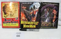 Three factory sealed DVD movies Beast of the Yellow Night, Hercules Against the Moon Men, Teenage Exorcist displayed standing side by side.