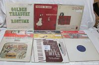 Overview of 12 vinyl record sleeves, showing mixed titles and styles including Golden Treasury of Ragtime and others. Covers show signs of wear such as spine splits and age.