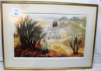 Framed Mid-Century Modern lithograph depicting a landscape scene with trees and hills, signed and hand numbered.