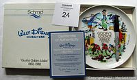 Collector's plate showing colorful Goofy illustrations, original Schmid Walt Disney box, and Certificate of Authenticity.