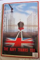 Full view of the framed vintage British WW2 naval propaganda poster showing a ship entering a shipyard with the Union Flag and the words 'THE NAVY THANKS YOU'.