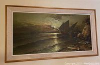 Full view of large framed ocean ships and canoe painting showing sailing ships and rocky shoreline in a wooden frame.