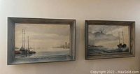 Two framed boating landscape paintings by Peter Lloyd hung on a wall, showing size and style with related colors and framing.