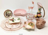 Full arrangement of the vintage lot including all items on a plain white background: Grimwades trinket dish, Depression glass plate, blown glass deer figurine, pink pig pottery figure, floral bud vase, Shafford pink shell dish, and ceramic apple dish.