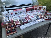 Overview of approximately 58 boxed Hallmark Keepsake Peanuts ornaments