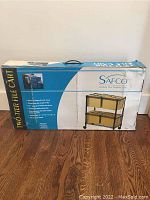 Box showing the Safco two-tier file cart with product details and packaging condition.
