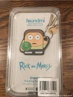 Photo of Rick and Morty Bluetooth tracking keychain in original packaging showing character design and branding information.
