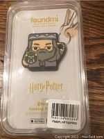 Photo of a Harry Potter themed Bluetooth tracking keychain in original packaging with 'foundmi' and 'Harry Potter' branding.