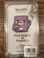Keychain tracking fob for Five Nights at Freddy's character in original packaging with barcode sticker. Three metal keys are attached to the keyring.
