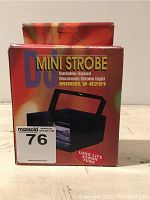 Box of DJ Mini Strobe Light Model V-8291 with colorful red and orange design highlighting variable speed electronic strobe light and long-life xenon tube.
