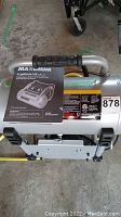Top view of the air compressor with instruction manual showing 4 gallons US/14L capacity and Maximum branding.