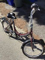 Full view of Schwinn folding bike showing frame, seat, rear rack, and front wheel.
